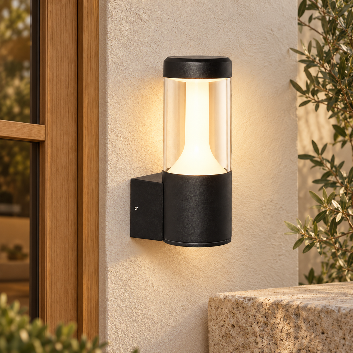 Aplique exterior cilíndrico negro mate con difusor opal, vista en ambiente instalado