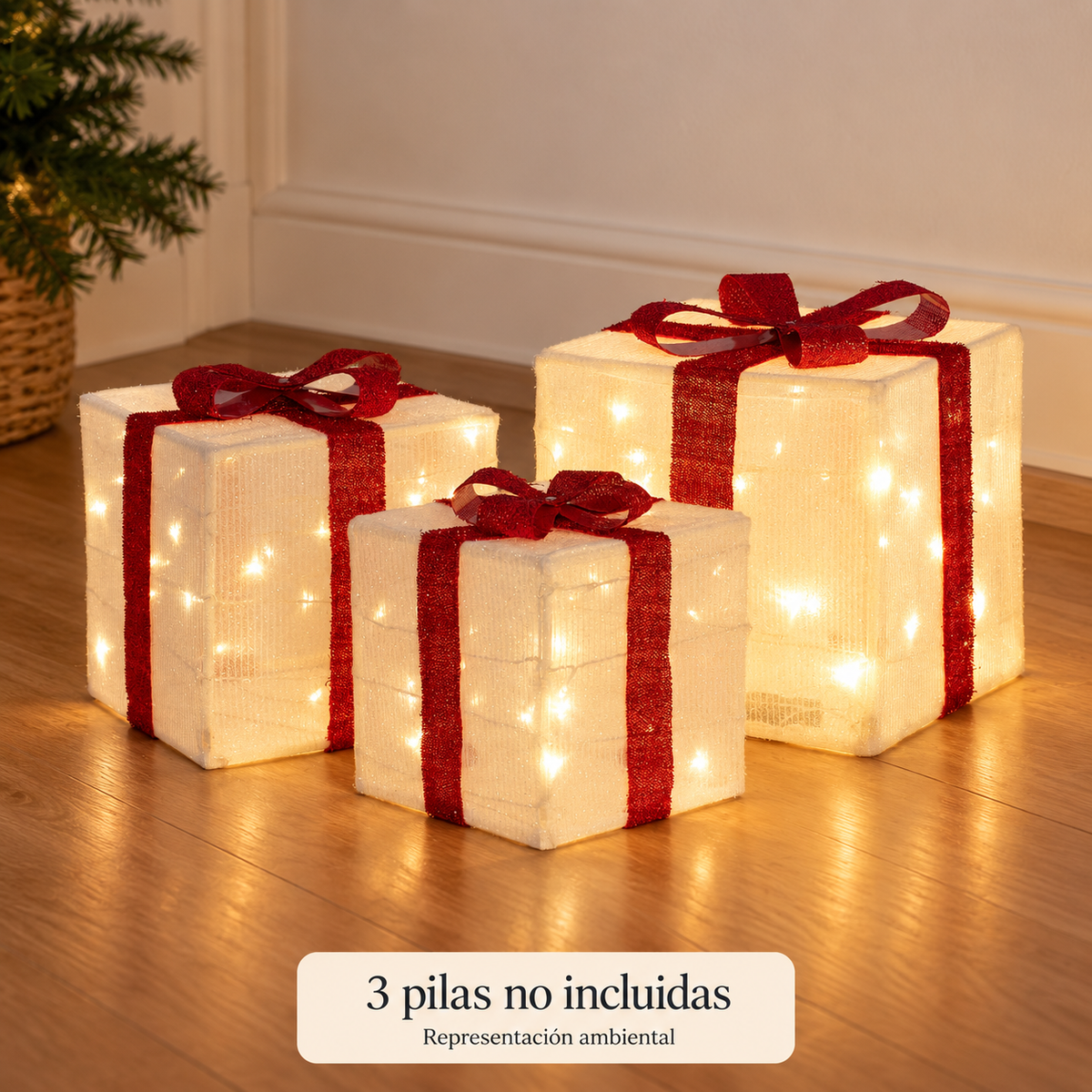 Tres regalos LED encendidos en interior, representación ambiental; tres pilas no incluidas