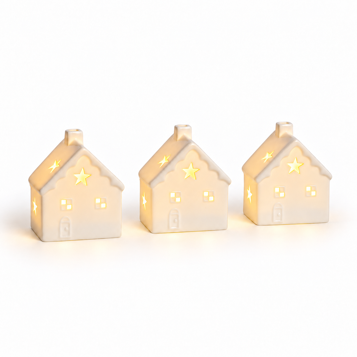 Set de 3 casas navideñas LED de cerámica blanca a pilas, luz encendida