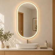 Espejo ovalado de baño LED 100 × 60 cm con antivaho y control táctil, vista en ambiente instalado